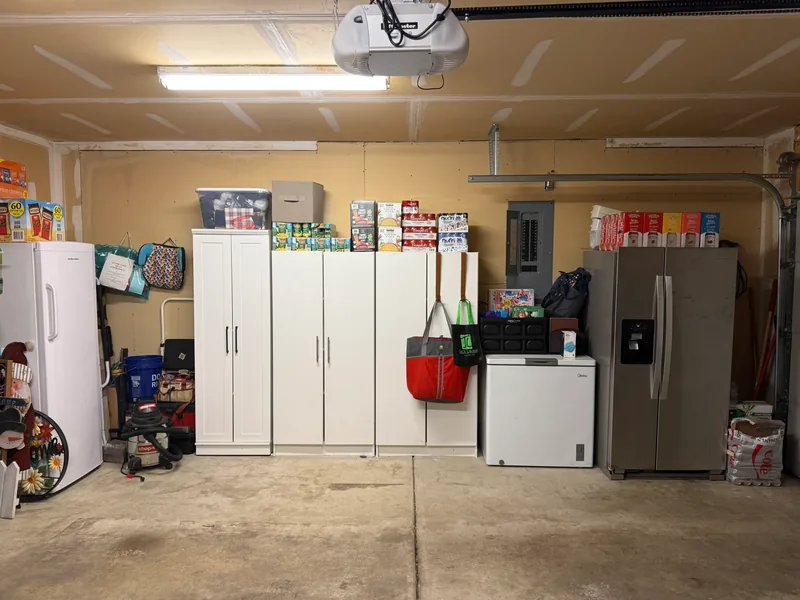 Same wall after, with cabinets accessible and items grouped around the appliances